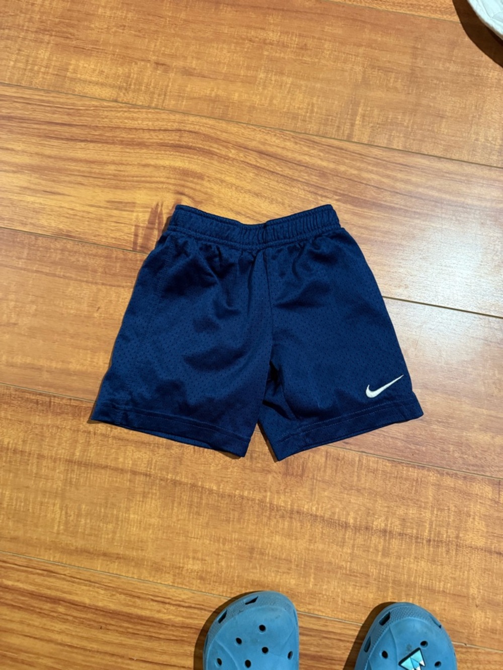 Nike Kids Navy Blue Athletic Mesh Shorts with White Swoosh